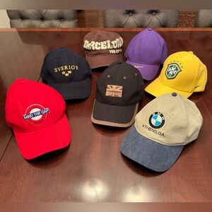 7 Assorted souvenir caps hats Nike, BMW, & various countries (1 lot of 7)